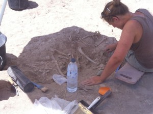 Picture of Michelle excavating bone from the chalcolithic Burial under the protection of a sun parasol, 17/07/2016. (c) Charlie Kerslake.